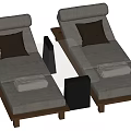 Gray Loungers with Wooden Frames Dark Cushions Folded Towels and Black Side Tables
