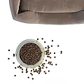 Soft Brown Pet Bed With Green Bowl And Scattered Pet Food