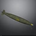 Green Military Bomb With Tail Fins And Yellow Markings On Gray Background