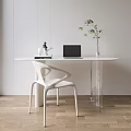 Modern White Oval Table and Chair Set With Laptop Green Plant and Decor