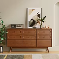 Modern Wooden Entryway Side Cabinet With Drawers Green Plant And Decorative Artwork