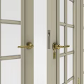 Light Colored Double Doors With Arched Glass Panes And Golden Handles