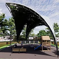 Modern Curved Pergola Structure In Outdoor Park With Playground Benches And Trees