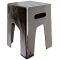 Modern Chrome Side Table with Geometric Legs and Cutout Detail for Contemporary Living Spaces