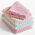 Soft Knitted Towels Stacked in Pastel Colors for Bathroom Decor and Daily Use