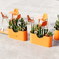 Outdoor Table Set with Orange Chairs and Planters Featuring Cacti on Gray Floor