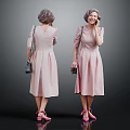 Woman in Pink Dress with Handbag Pink Shoes and Gray Hair Talking on Phone