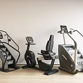Indoor Fitness Equipment Set With Stair Climbers Exercise Bike On Wooden Floor Against White Wall