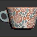 Colorful Ceramic Mug with Orange Interior Blue Handle and Red Floral Green Leaf Patterns
