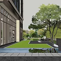 Hotel Building With Glass Facade Overlooking Garden Lawn And Trees