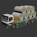 White Flatbed Truck Carrying Multiple Large Paper Rolls On Cargo Bed