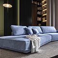 Blue Sectional Sofa with Plush Cushions and Throw Blanket in Modern Living Space