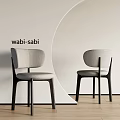 Wabi Sabi Style Gray Dining Chairs With Dark Wooden Legs And Minimalist Design