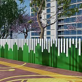 White And Green Fence With City Skyline Design Near Trees And Building On Paved Ground