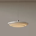 Modern Minimalist Pendant Light With Circular Shade And Warm Glow Against Neutral Wall