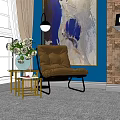 Comfortable Lounge Chair With Blue Wall Brown Brick Wall Artwork Side Table And Green Plant