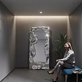 Modern Irregular Shaped Decorative Mirror With Indoor Plant And Woman Sitting In Minimalist Room