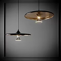 Two Modern Pendant Lights Black Shade Golden Interior Warm Light Glow Design