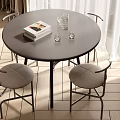 Modern Round Dining Table Set With Black Tabletop Light Gray Cushioned Chairs And Glass Cups