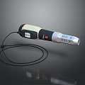 Handheld Electronic Appliance With Black White Orange Design Display Screen Control Buttons And Lanyard Cable
