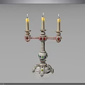 Decorative Candelabra With Three Lit Candles And Colorful Accents On Base