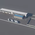 Aerial View of Modern Industrial Factory Building with White Exterior Blue Roof and Parking Area
