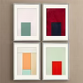 Four Framed Decorative Paintings With Geometric Shapes And Various Colors On Beige Wall