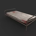 Single Bed with Metal Frame and Red Stained Mattress Surface