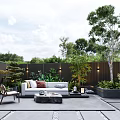 Modern Outdoor Garden Lounge Area With Sofa Chair Coffee Table Green Plants And Trees