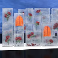 Instagrammable Photo Spot With Ice Cubes Containing Red Roses And Blue Sky Background
