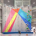 Colorful Indoor Climbing Wall In Shopping Mall With Climbing Holds And People