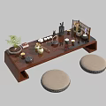 Traditional Wooden Tea Table And Round Cushioned Stools With Tea Utensils Plant And Screen