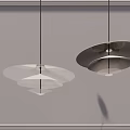 Modern Layered Disc Shaped Chandeliers With Warm Light Hanging In Interior