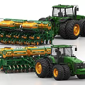 Green Agricultural Tractors With Large Yellow Tires And Multiple Seeder Units