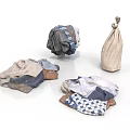 Household Laundry Items Featuring Folded And Rolled Clothes With Burlap Bag