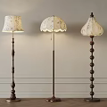 Vintage Floor Lamps Featuring Decorative Fabric Shades And Wooden Beaded Bases For Interior Decor