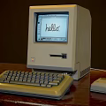 Vintage Computer Setup On Wooden Desk With Monitor Keyboard Mouse And Hello Text Displayed