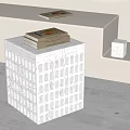 Modern Black Marble Side Table With Perforated Design And Stacked Books On Top