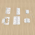 Various Metal Hinges And Small Screws On Wooden Table Top