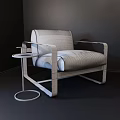 Modern Leisure Chair With Metallic Frame Dark Fabric Upholstery And Round Side Table