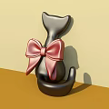 Black Cat Ornament With Large Red Bow Photo Spot On Light Yellow Brown Gradient Background