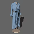 Mannequin Wearing Blue Long Robe With Black Belt And Ruffled Cuffs