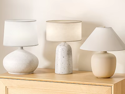 Three Modern Ceramic Table Lamps with White Lampshades on Light Wood Cabinet 3d model
