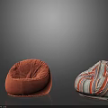 Two Different Bean Bag Chairs with Orange Velvety and Colorful Striped Designs