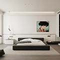 Modern Bedroom Interior With Black Bed White Cabinets Portrait Artwork And Natural Light