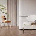Upholstered Single Chairs with Metal Legs on Wooden Floor Vertical Striped Wall and Potted Plant