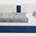 Upholstered Daybed In Blue And White With Gray Linen Throw And Decorative Pillows