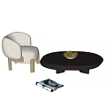 Modern Black Round Coffee Table with Fruit Bowl and Beige Chair on Marble Floor