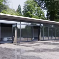 Modern Building With Glass Curtain Walls Courtyard And Surrounding Trees
