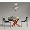 Modern Round Dining Table Set With Orange Legs And Black Chairs With Silver Metal Legs